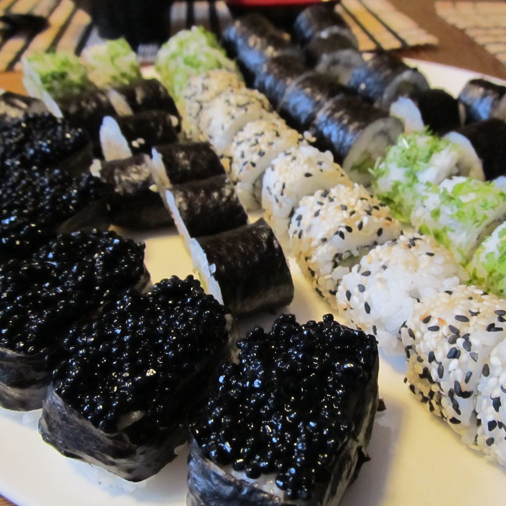 Fresh salmon nigiri with glistening rice, crafted by hand